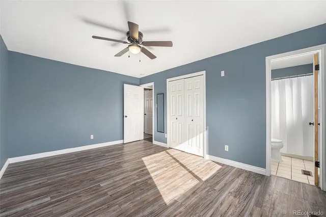 a view of an empty room and wooden floor