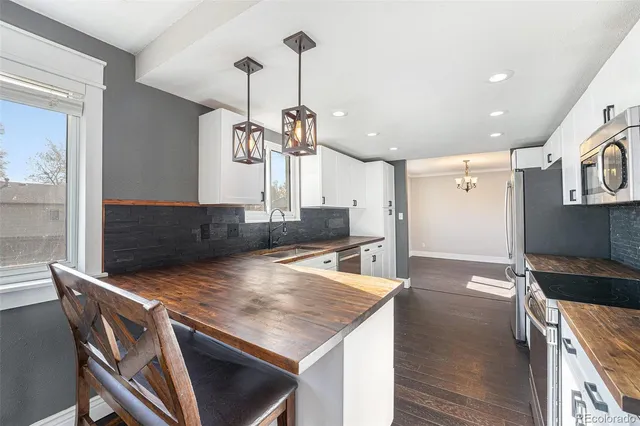a kitchen with a table and chairs in it
