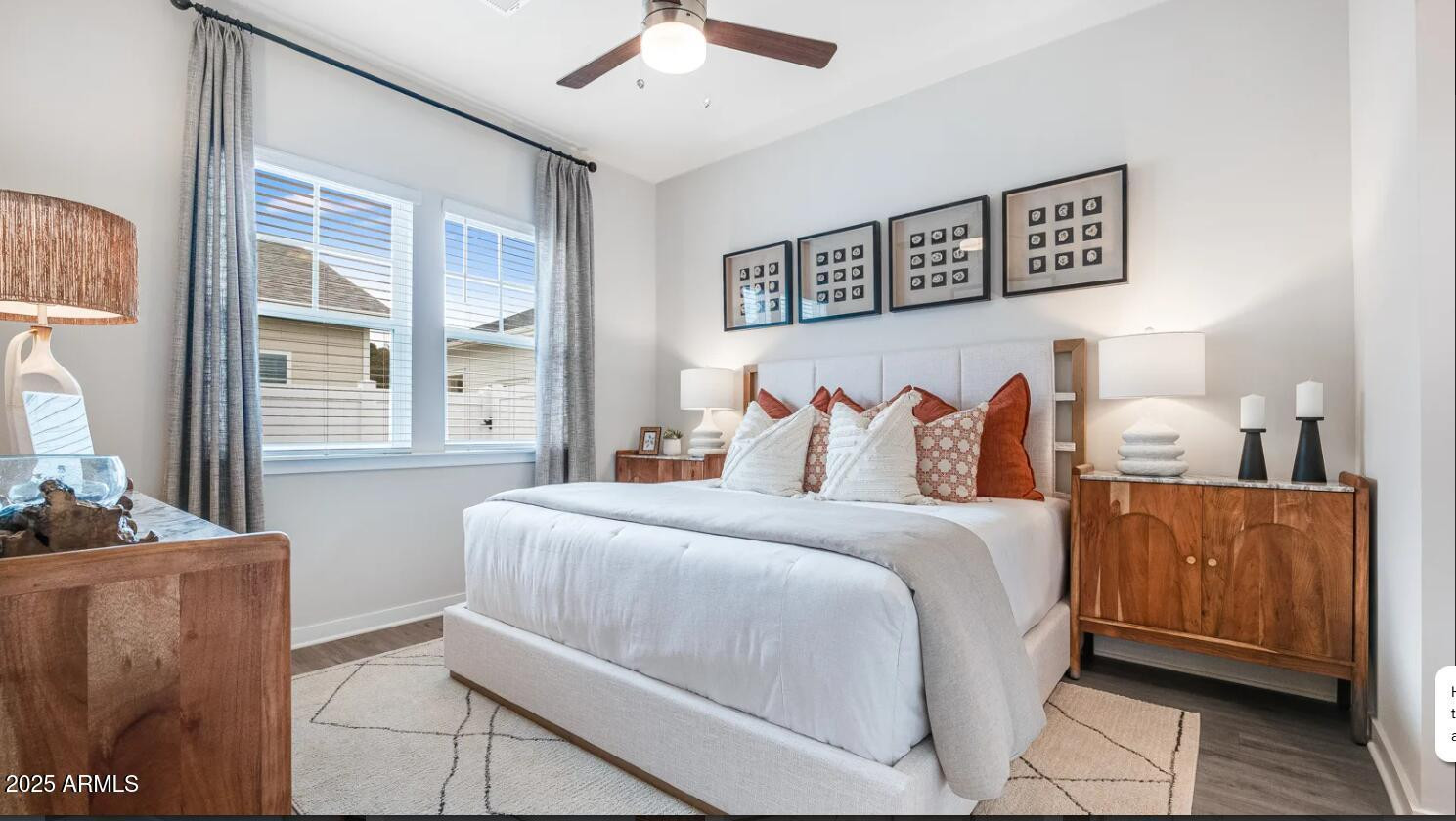 20807 West Indian School Road, Unit 1 Buckeye, AZ 85396 - Photo 4 of 5 a spacious bedroom with a bed and wooden floor