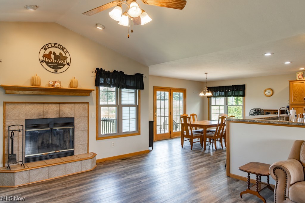 8383 Ickes Road Wooster, OH 44691 - Photo 15 of 32 Living room with dark hardwood flooring, ceiling fan, and a tile fireplace
