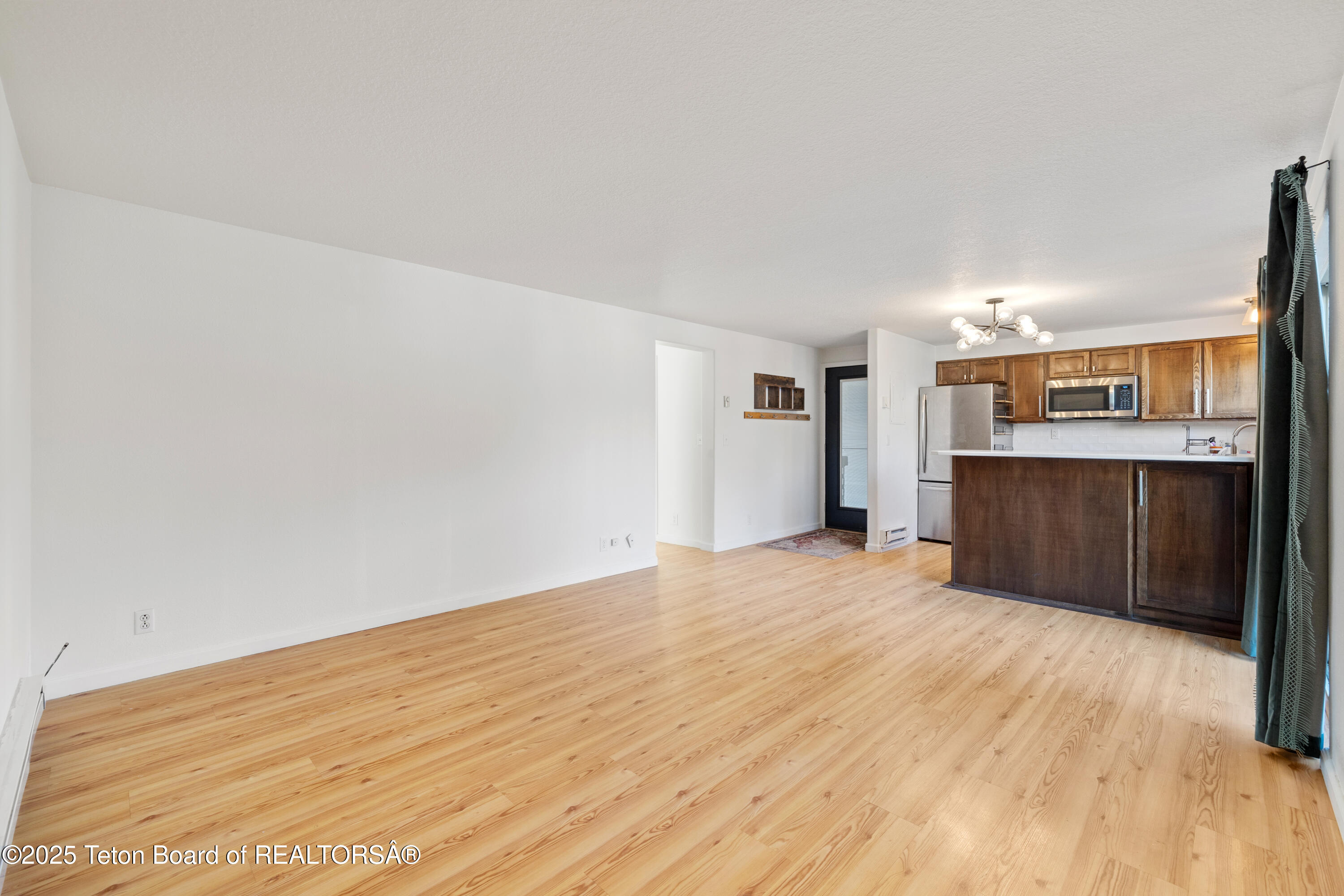 750 Powderhorn Lane, Unit K4 Jackson, WY 83001 - Photo 4 of 10 Living Room to Kitchen