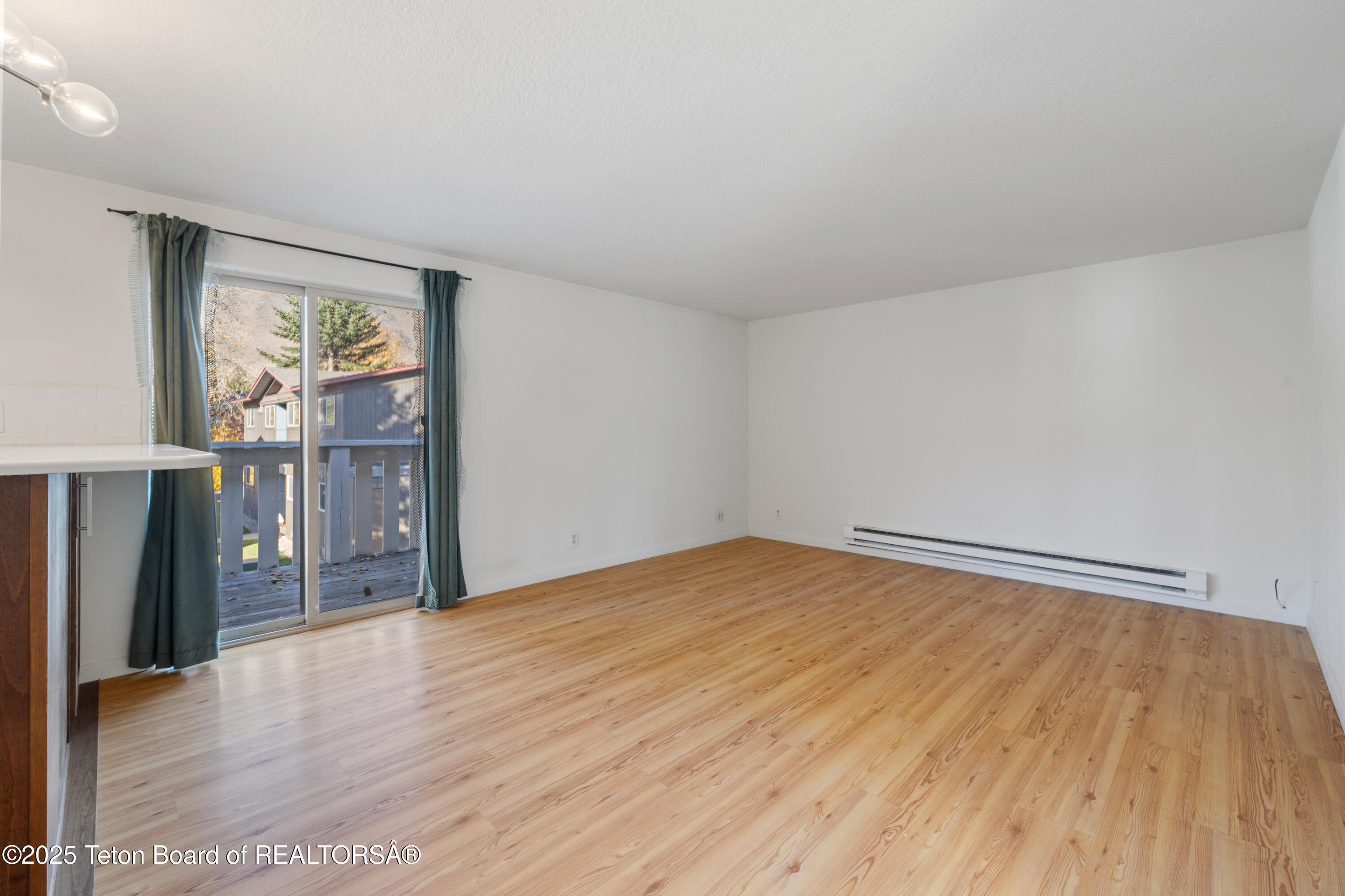750 Powderhorn Lane, Unit K4 Jackson, WY 83001 - Photo 6 of 10 Living Room Sliding Doors