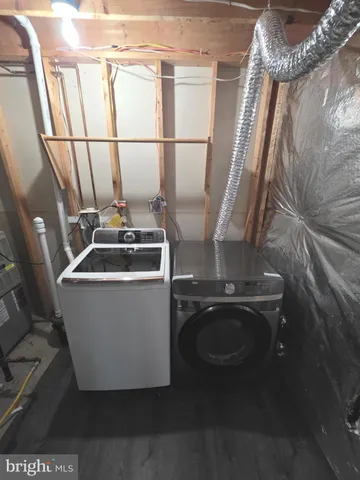 a white bath tub sitting in a bathroom