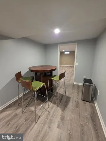 a workspace with furniture and wooden floor