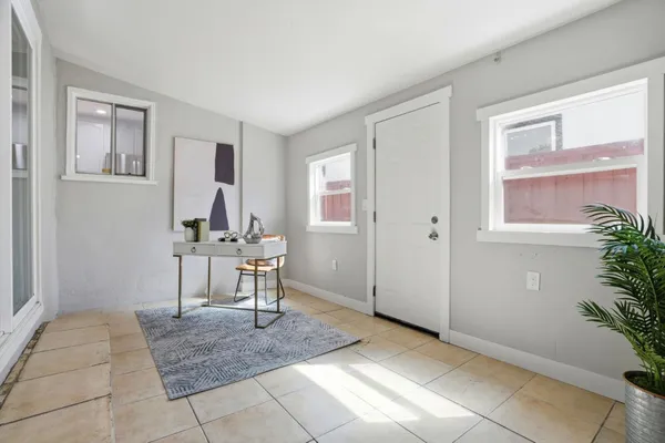 a view of a livingroom with furniture and window