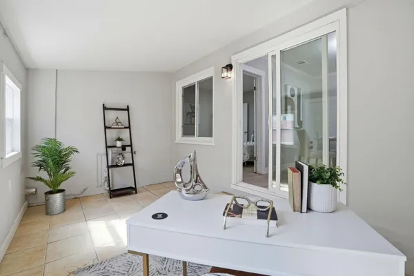 a bathroom with a sink a mirror and a window
