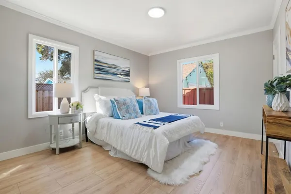a bedroom with bed and a window