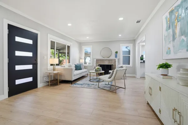 a living room with furniture and a fireplace