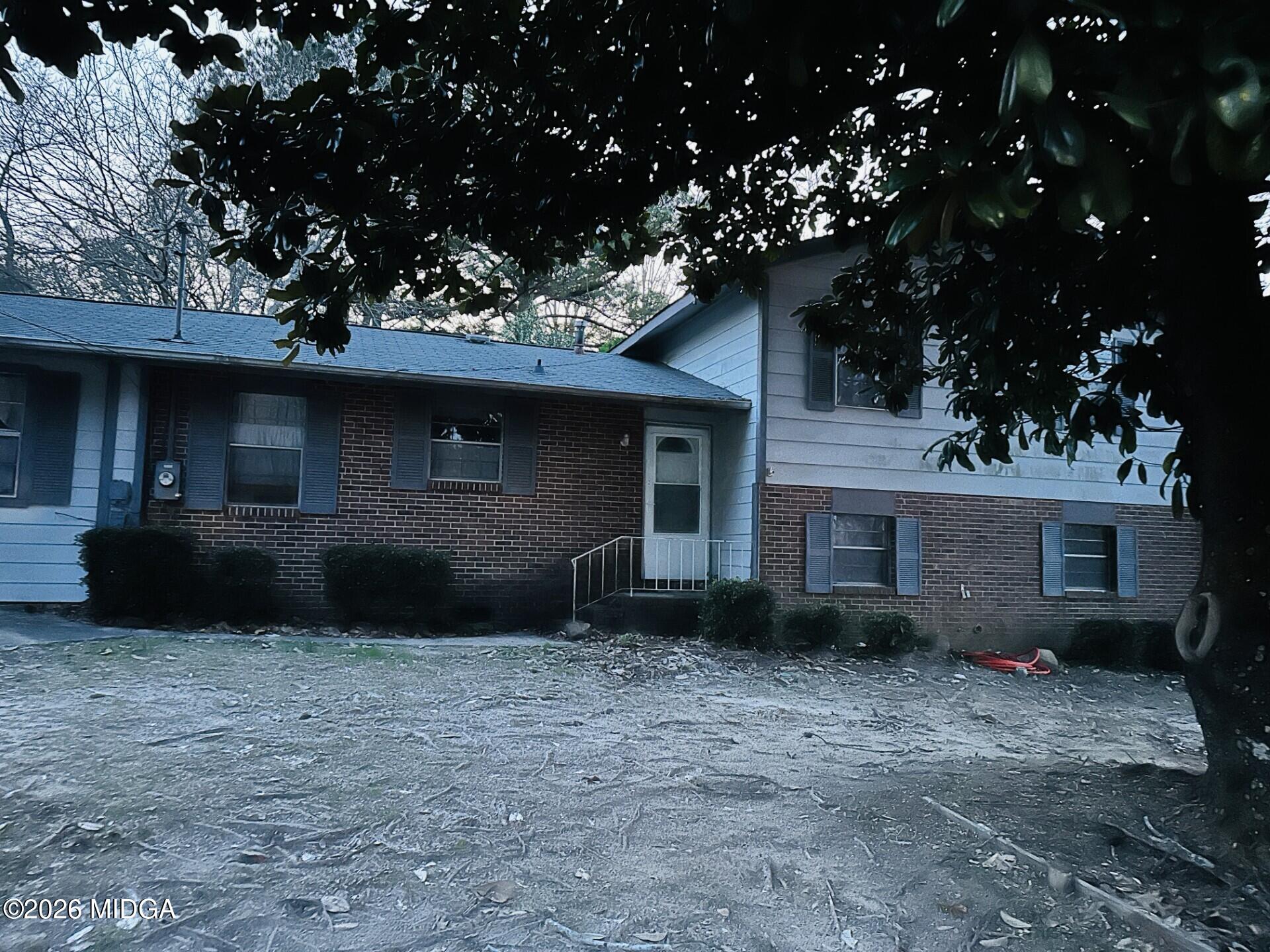 a view of a house with a yard