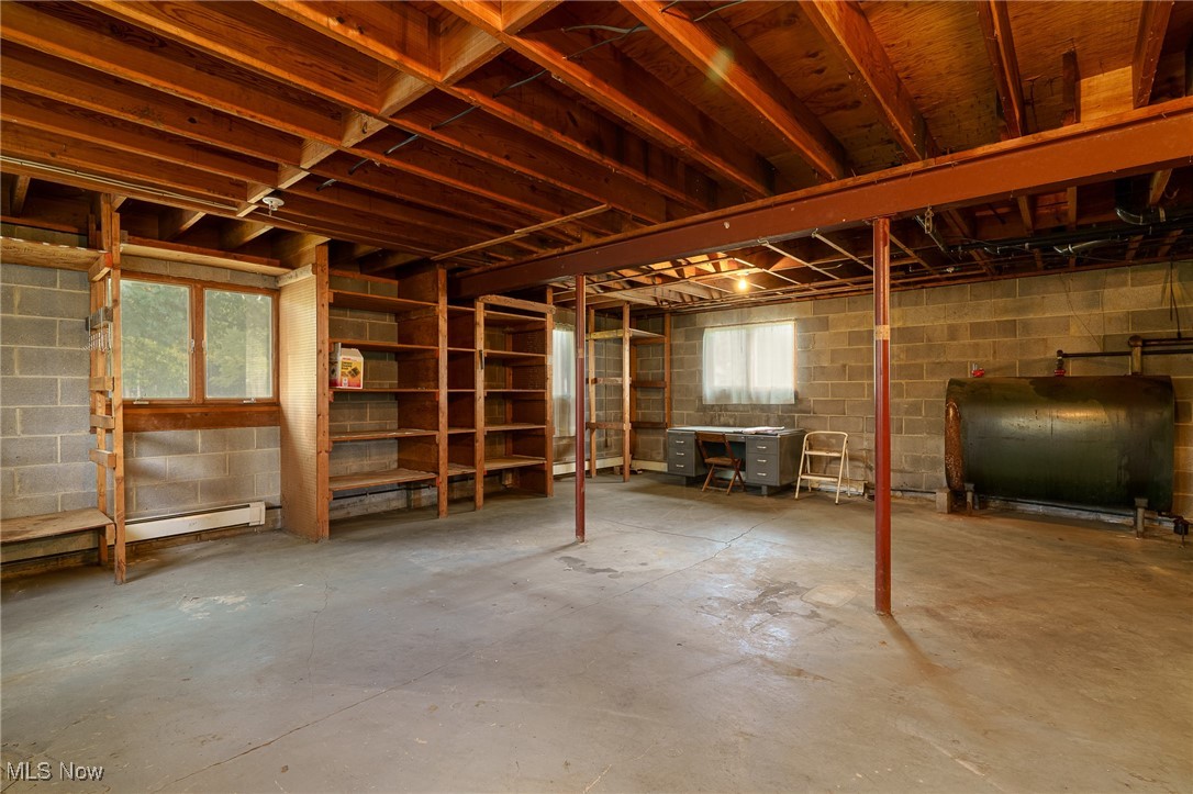 6747 Giddings Road Rootstown, OH 44272 - Photo 23 of 39 Basement with heating fuel and lots of storage