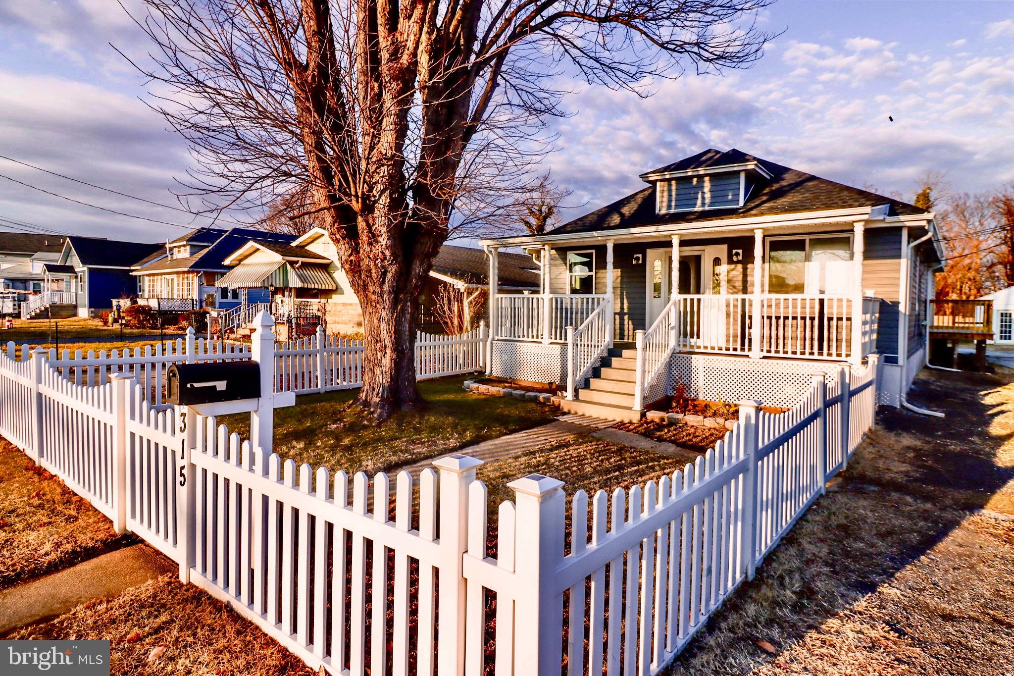 Charming home with white picket fence.