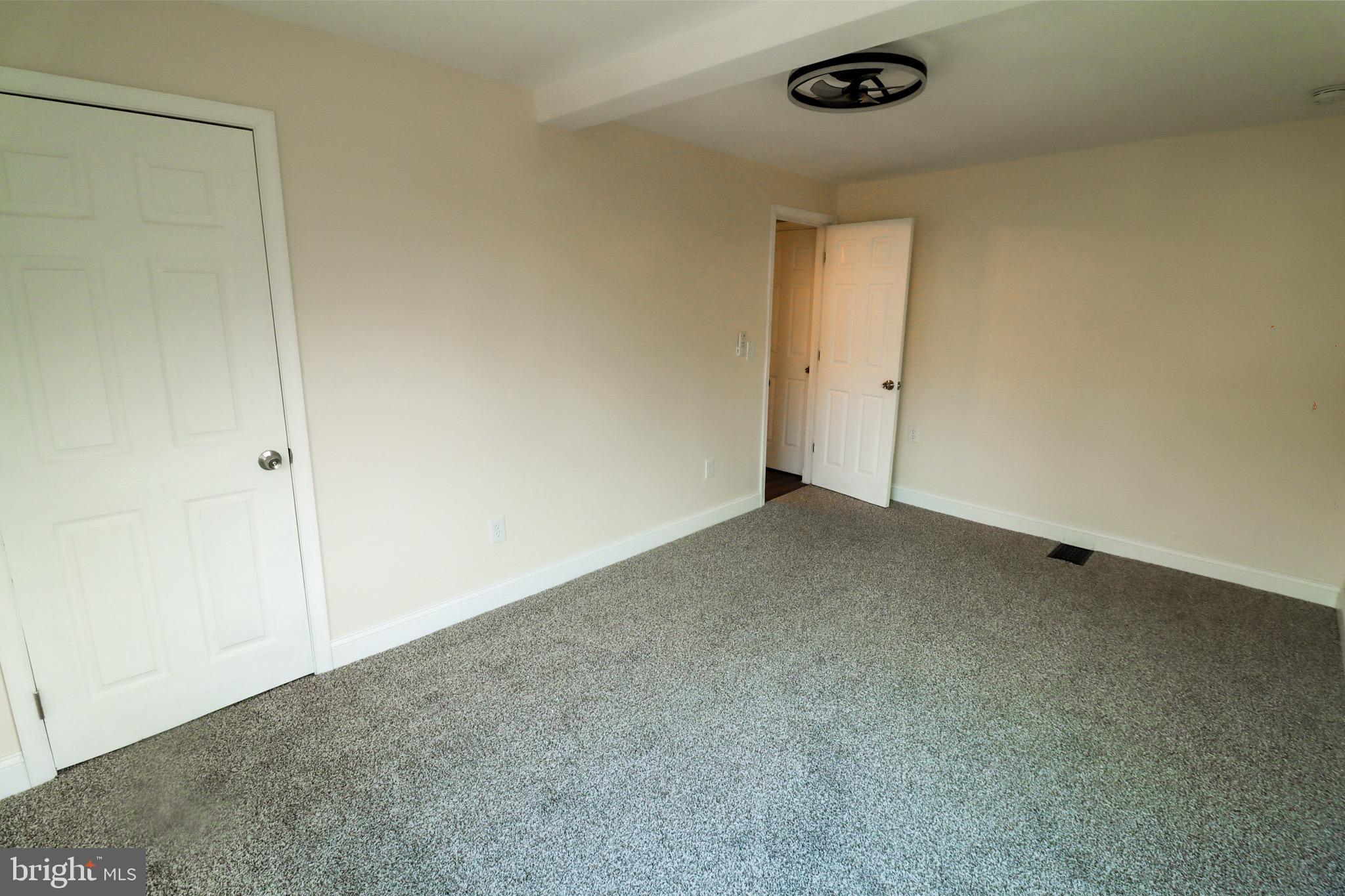 315 Riverside Drive Baltimore, MD 21221 - Photo 19 of 22 a view of an empty room and a window