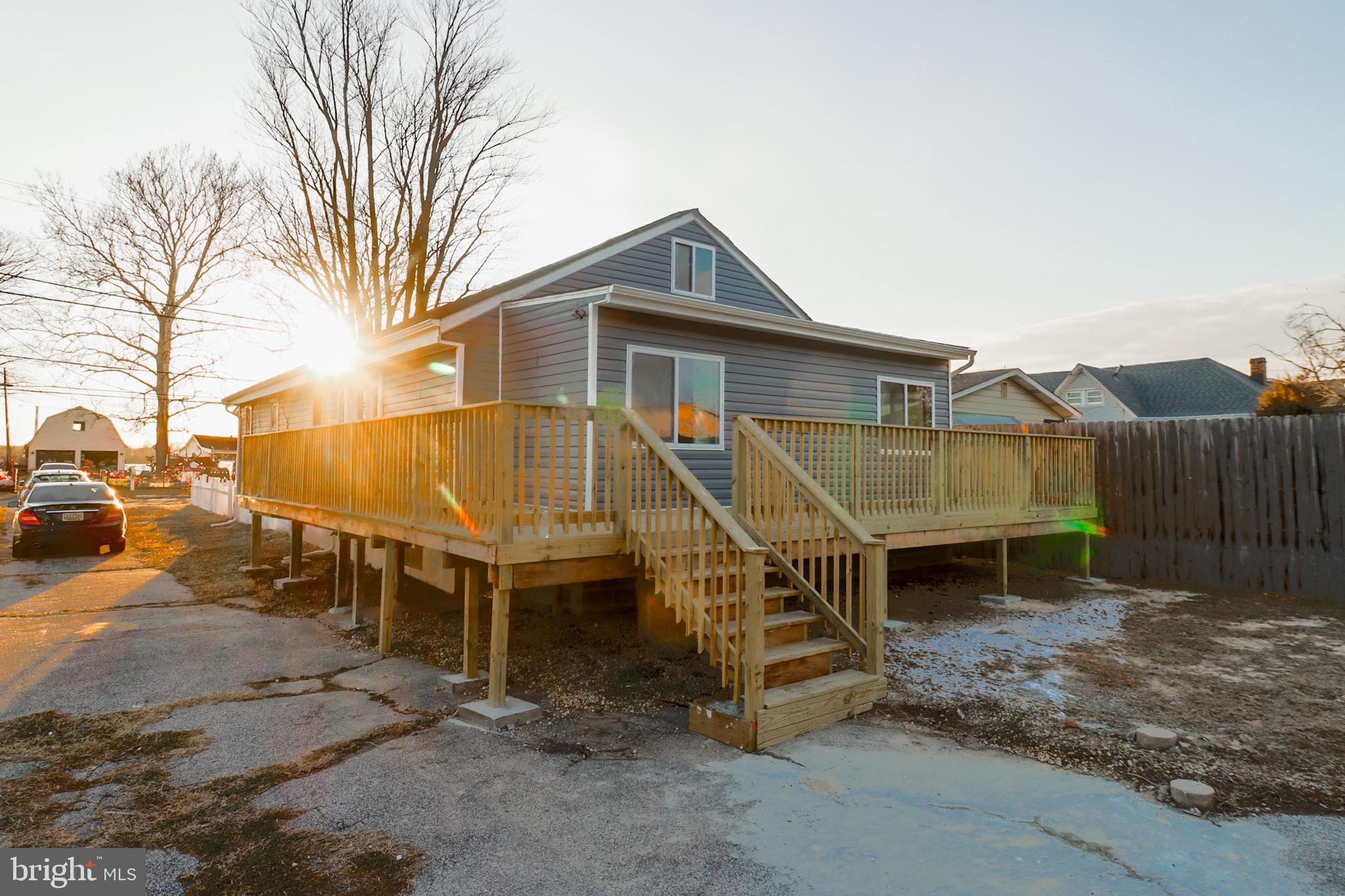 315 Riverside Drive Baltimore, MD 21221 - Photo 2 of 22 Sunlit rear exterior with spacious deck