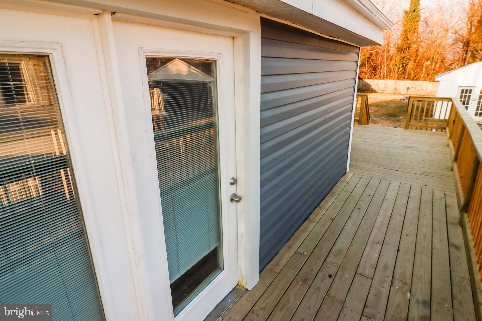 315 Riverside Drive Baltimore, MD 21221 - Photo 3 of 22 Charming entryway to a sunlit deck.