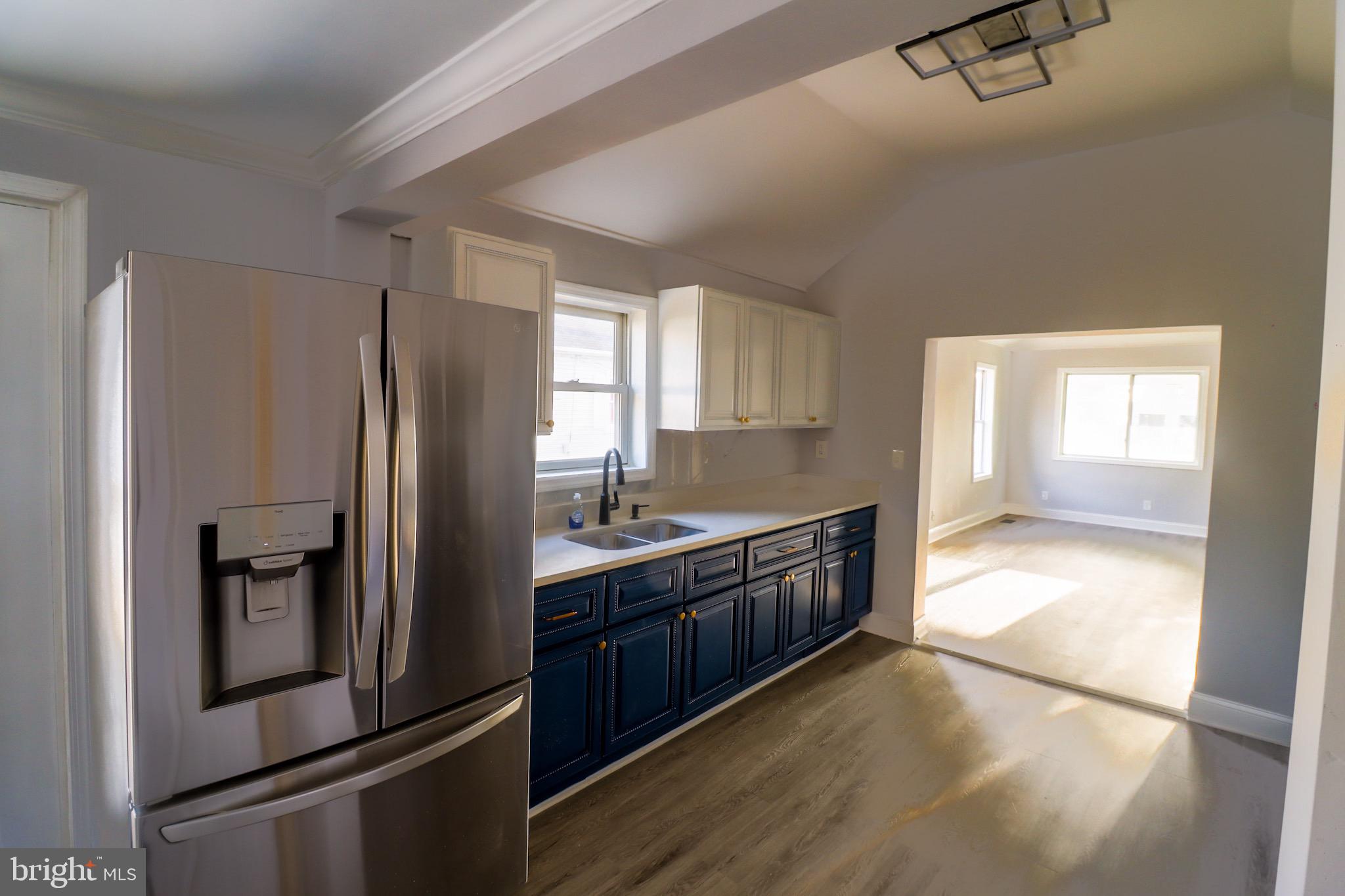 315 Riverside Drive Baltimore, MD 21221 - Photo 9 of 22 a kitchen with stainless steel appliances granite countertop a refrigerator a sink and a stove