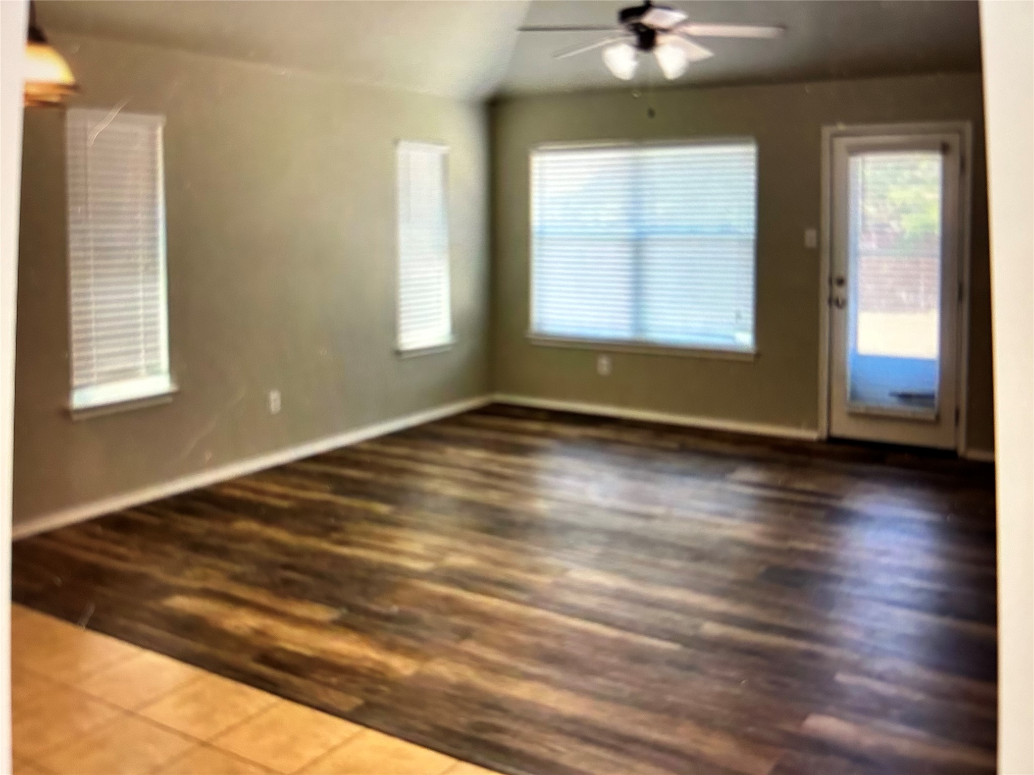 211 Animas Drive Georgetown, TX 78626 - Photo 8 of 25 an empty room with wooden floor and windows