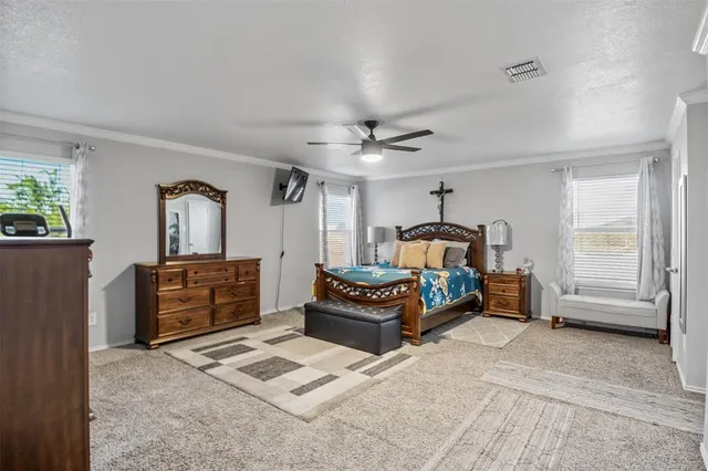 a bedroom with furniture and window