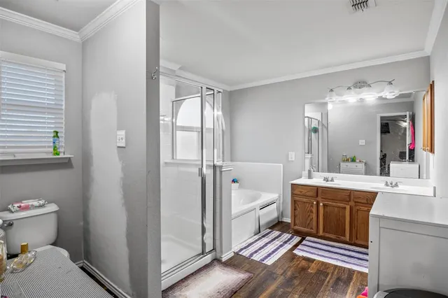 a room with a bed and a view of bathroom