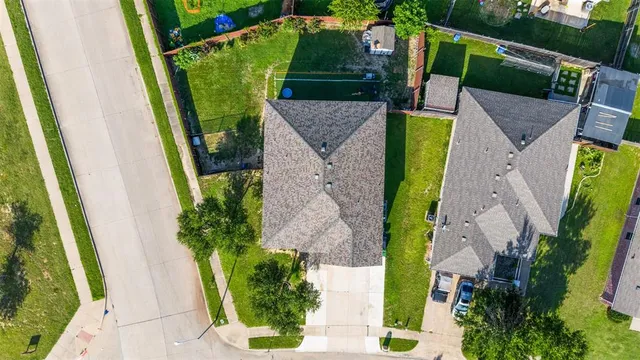 an aerial view of a house with a garden