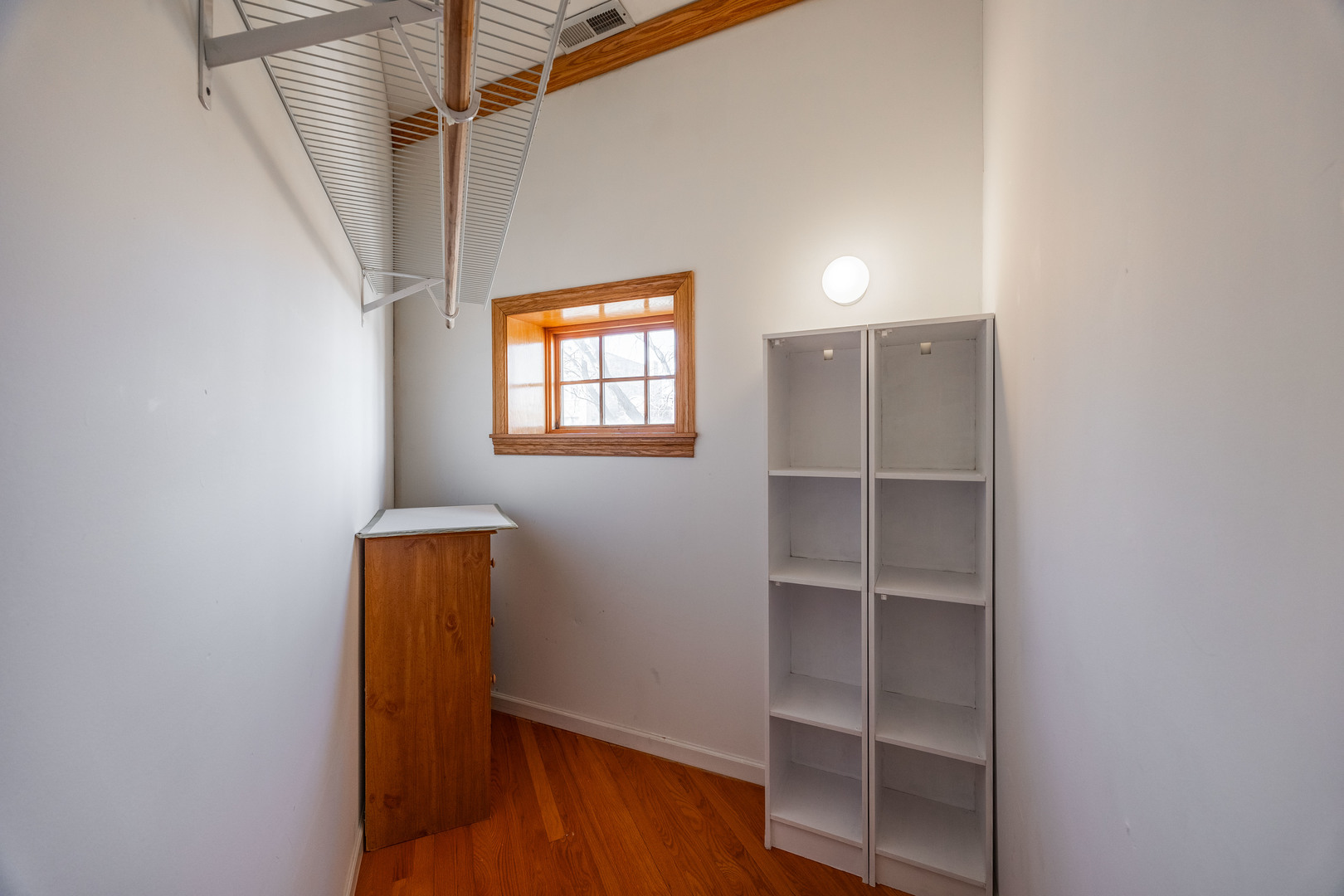 3107 North Harding Avenue, Unit 2W Chicago, IL 60618 - Photo 11 of 14 a view of walk in closet with empty racks