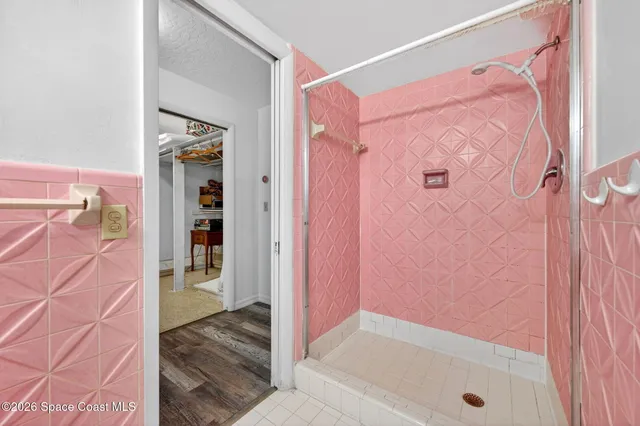 a bathroom with a bathtub and a shower