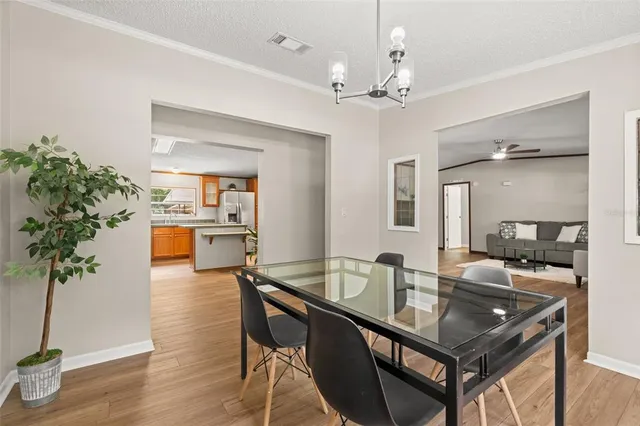 a kitchen with a table and chairs in it