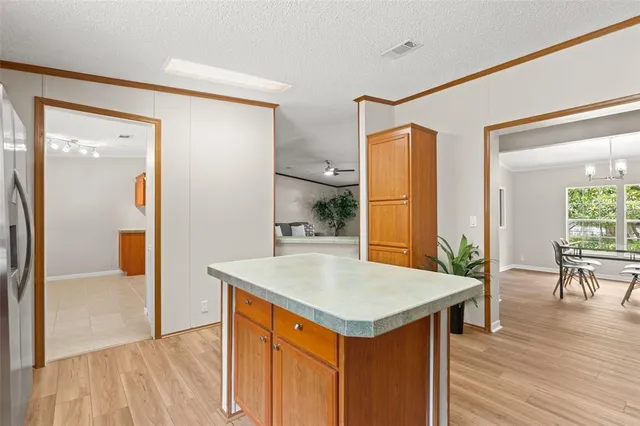 a view of kitchen with furniture and wooden floor