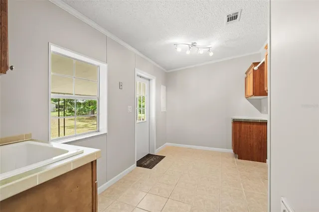 a view of an empty room with a window