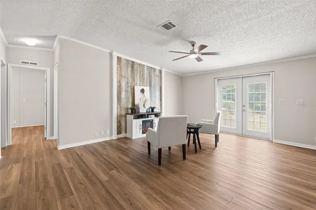 a view of a dining room with furniture window and wooden floor