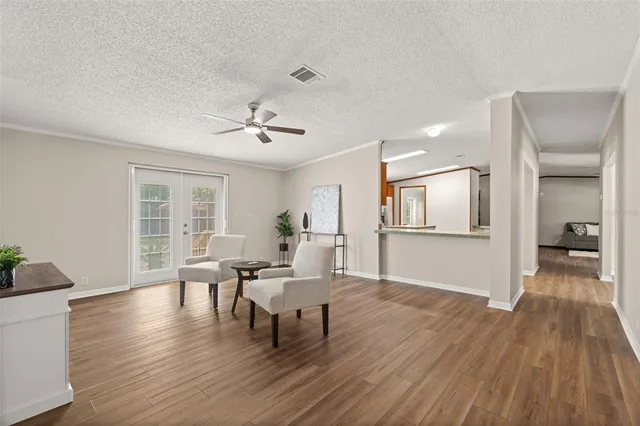 a view of a livingroom with furniture and wooden floor