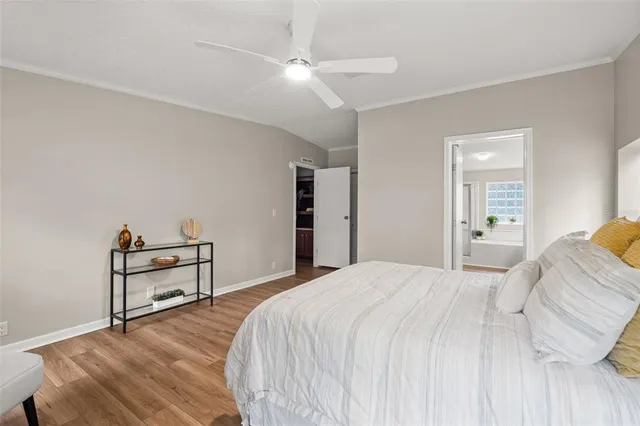 a bedroom with a bed and cabinets