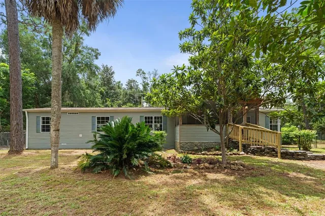 a house with a tree in front of it