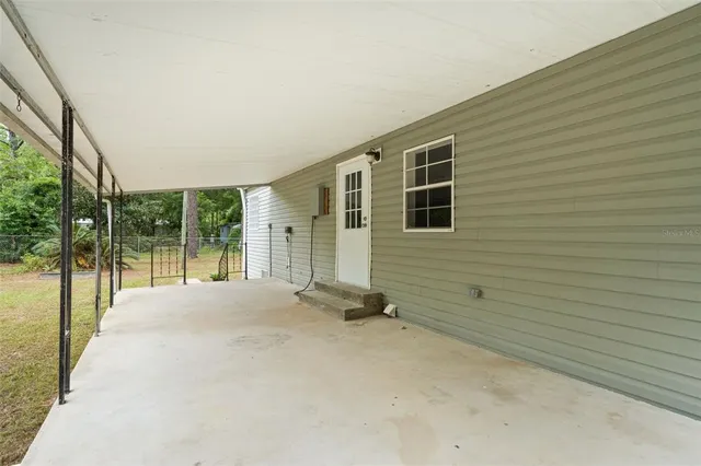 a view of an empty room with a balcony
