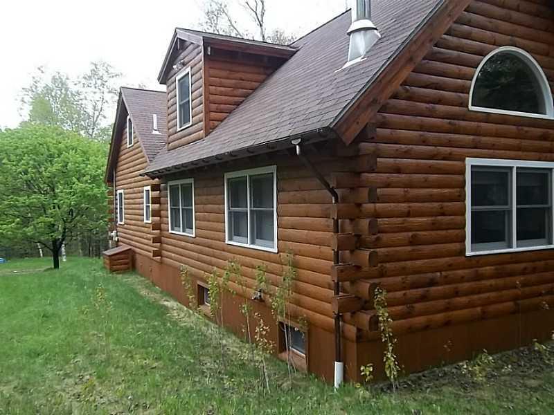 176 Stephens Road Oquossoc, ME 04964 - Photo 23 of 30 Exterior Side View. back addition...