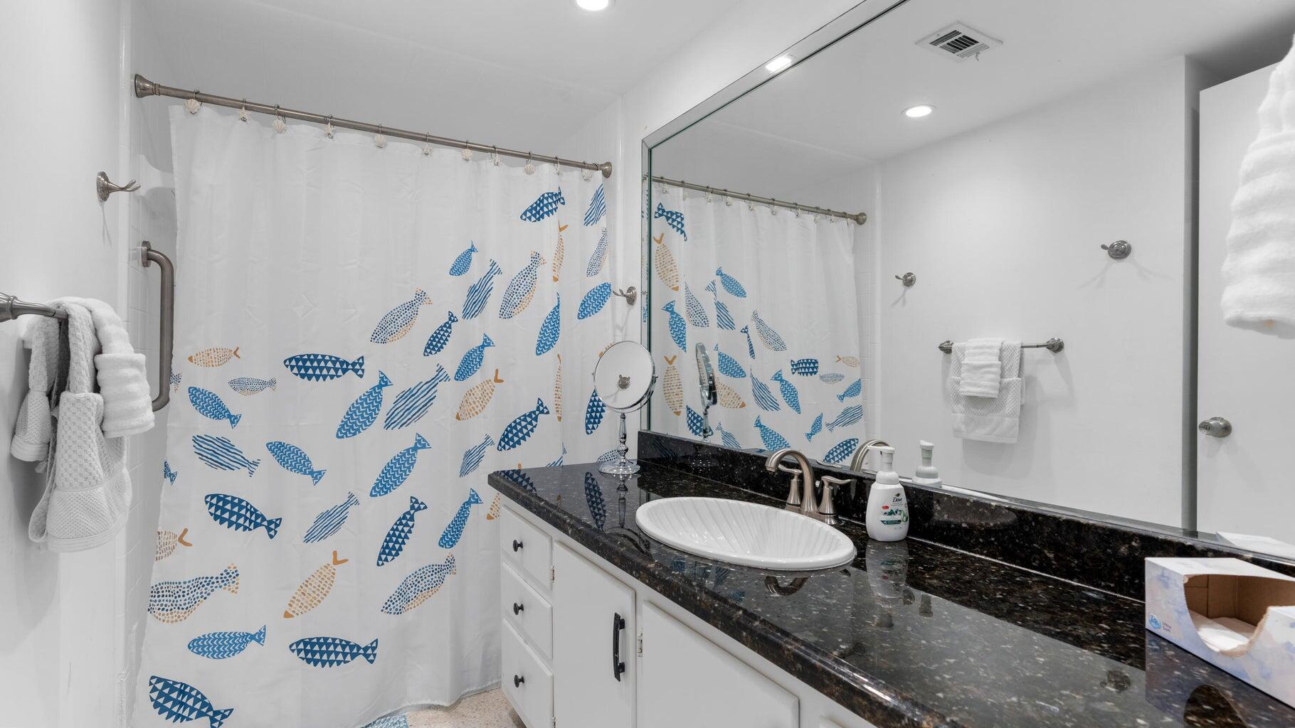 410 Venetian Drive Delray Beach, FL 33483 - Photo 17 of 28 a bathroom with a granite countertop sink and a mirror