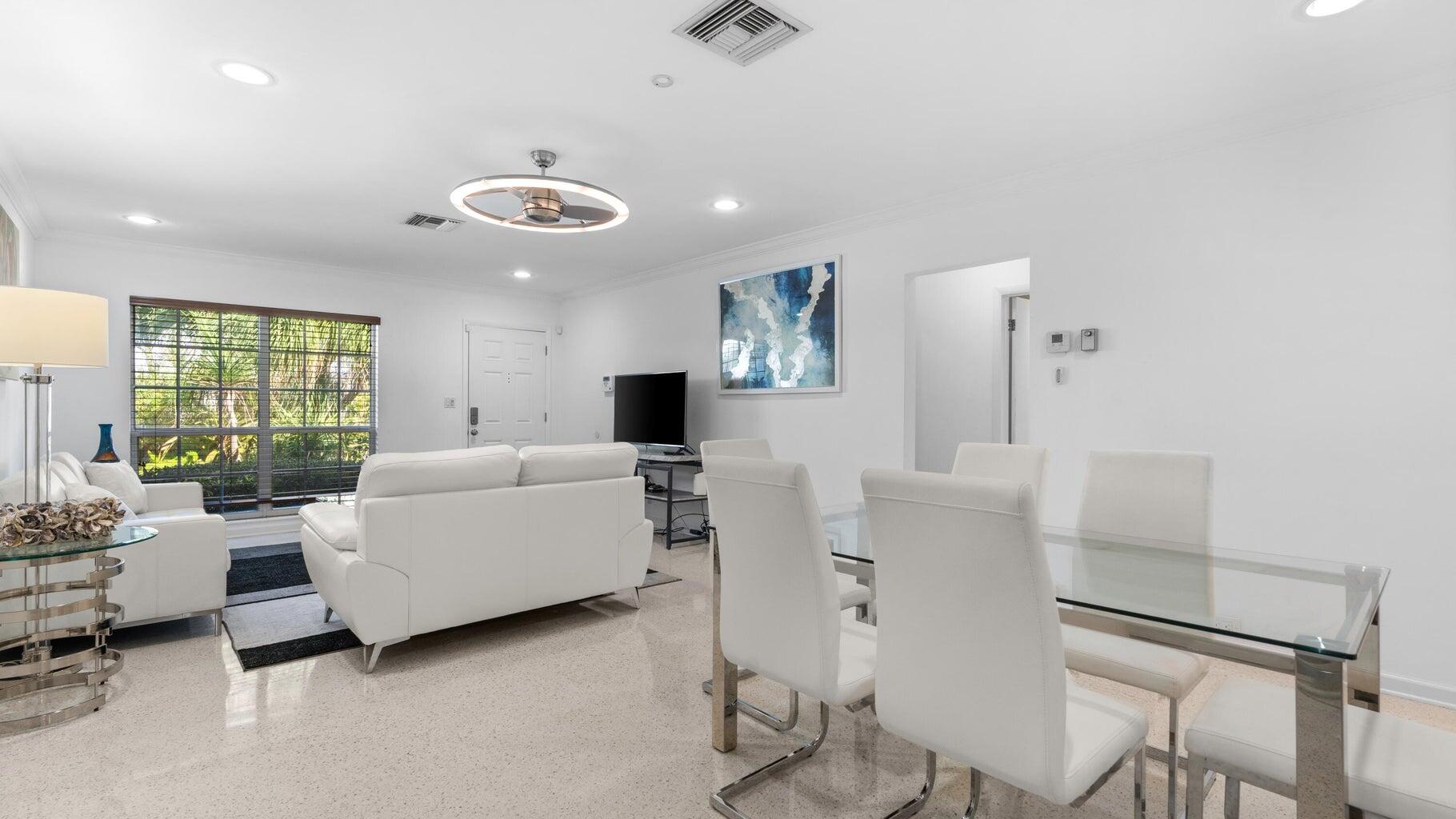 410 Venetian Drive Delray Beach, FL 33483 - Photo 19 of 28 a living room with furniture and a window