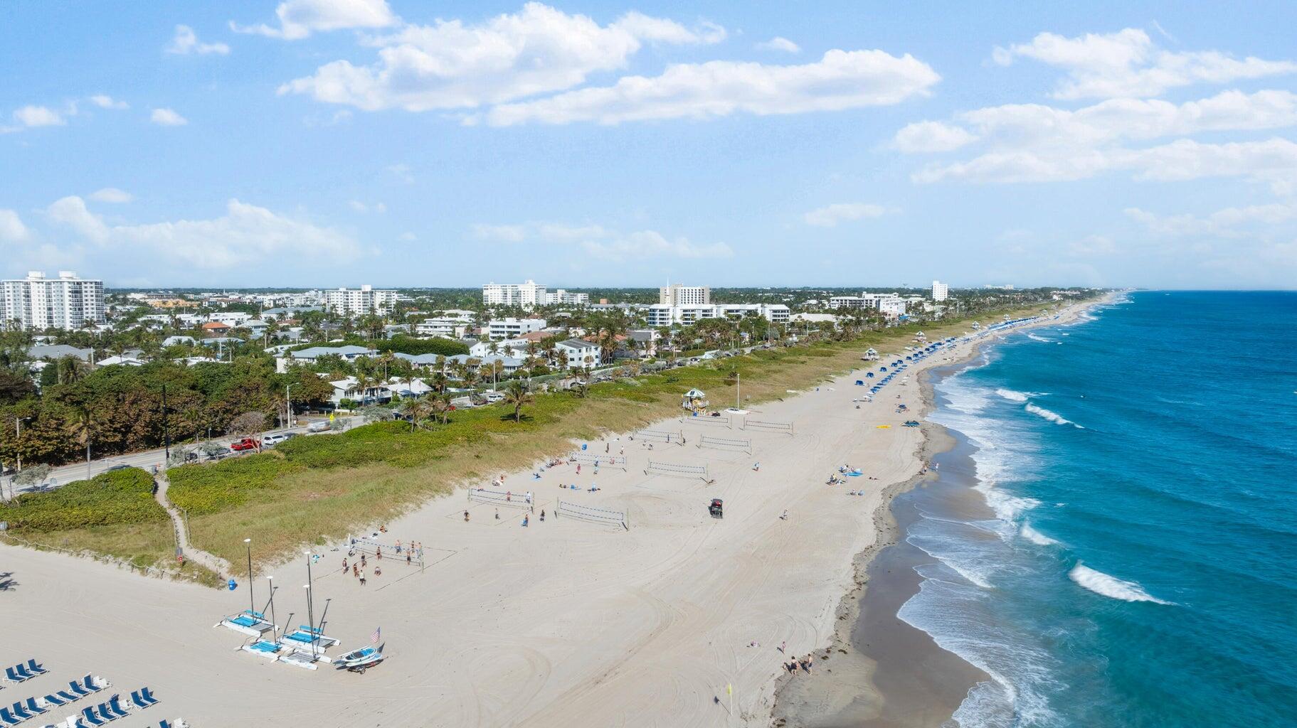410 Venetian Drive Delray Beach, FL 33483 - Photo 2 of 28 a view of a lake with a city