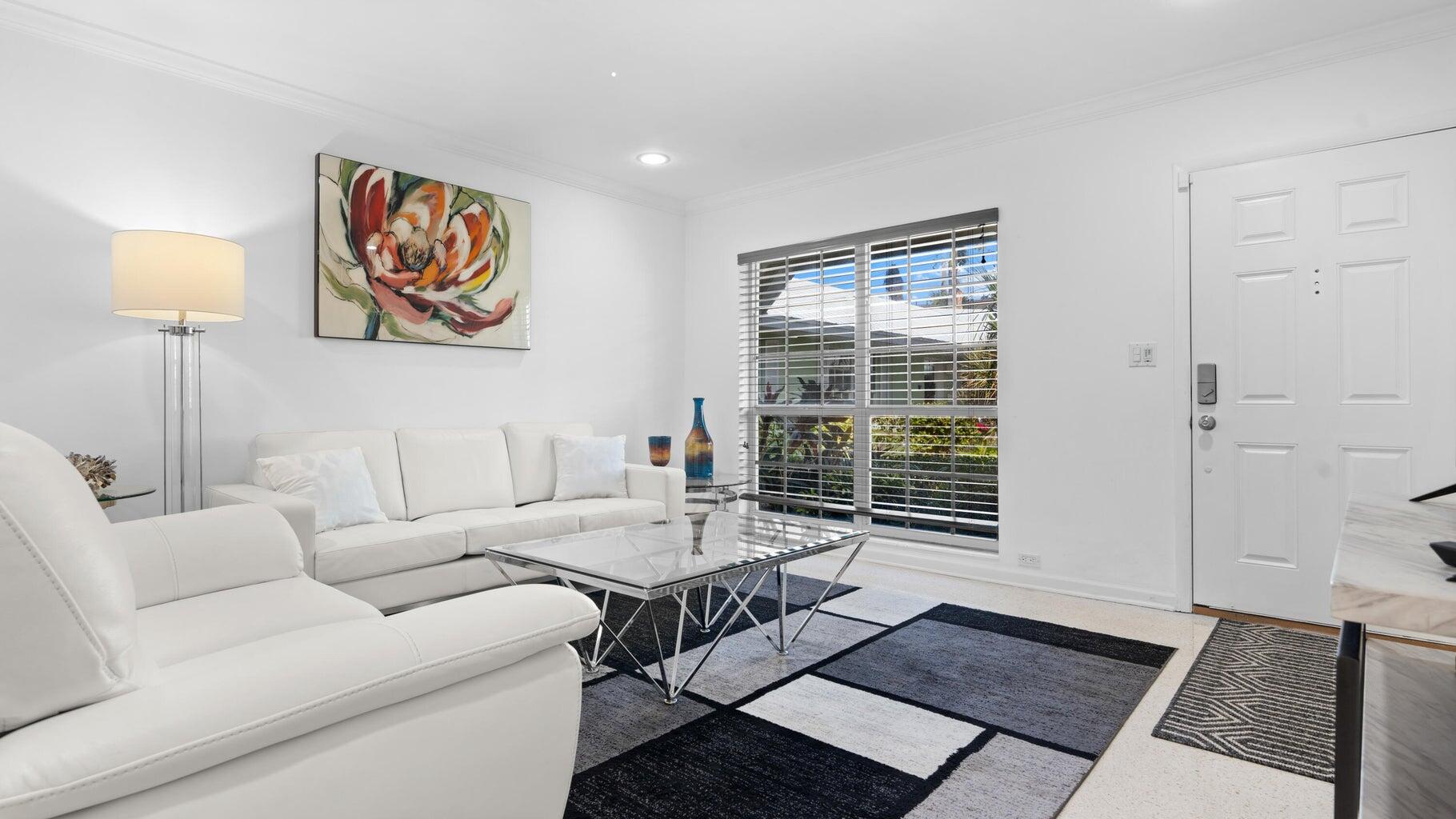 410 Venetian Drive Delray Beach, FL 33483 - Photo 21 of 28 a living room with furniture and a window