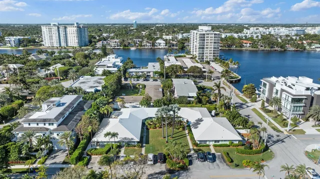 an aerial view of a house with a lake view
