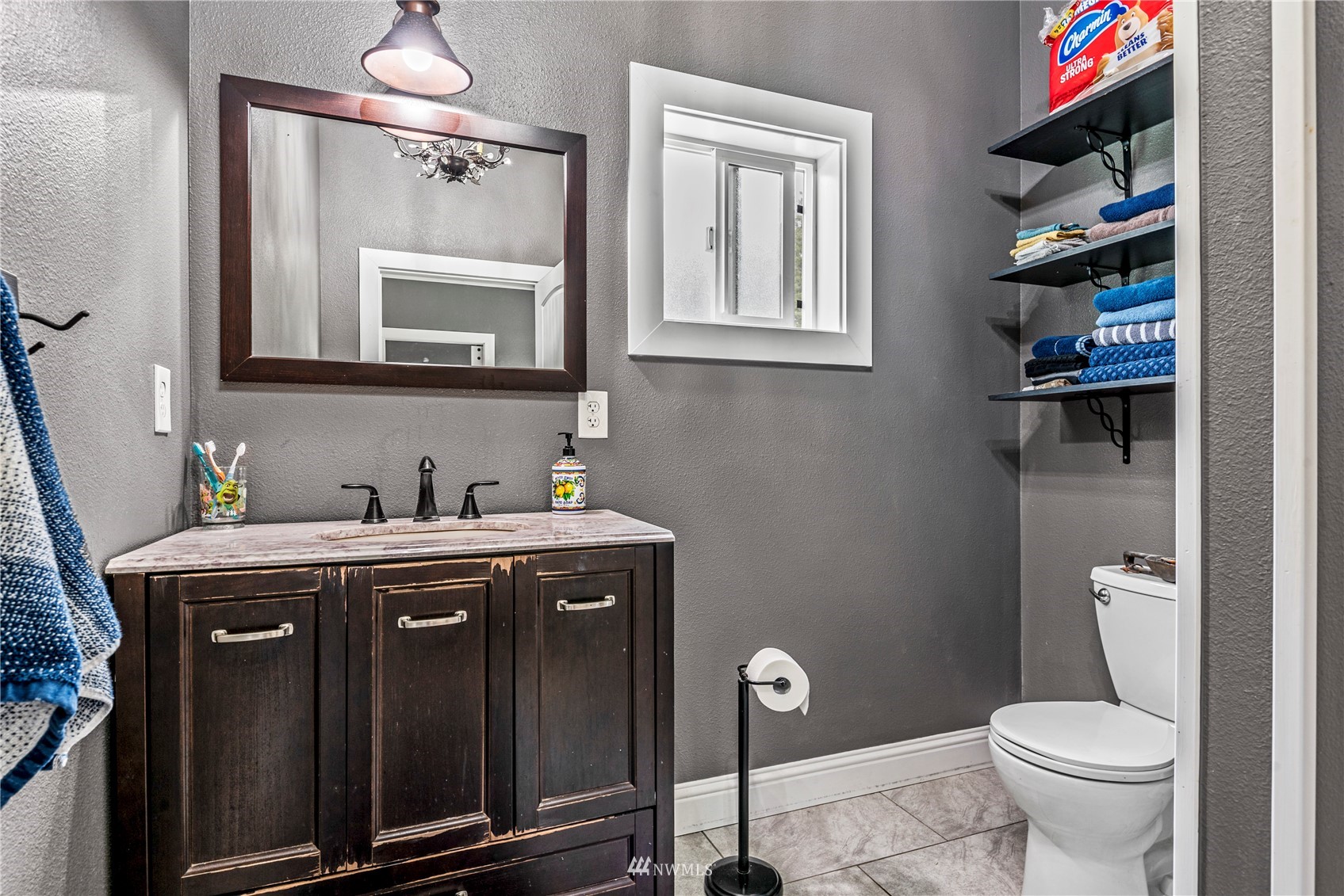 810 Logan Hill Road Chehalis, WA 98532 - Photo 15 of 39 a bathroom with a granite countertop toilet sink and mirror