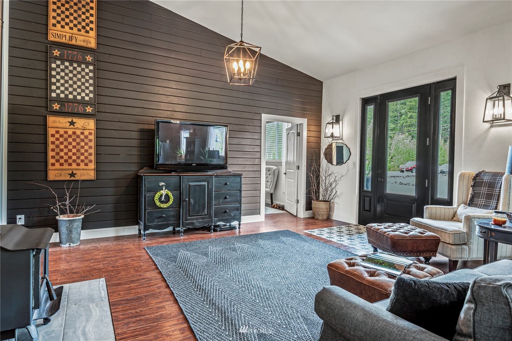 810 Logan Hill Road Chehalis, WA 98532 - Photo 17 of 39 a living room with furniture a flat screen tv and a fireplace