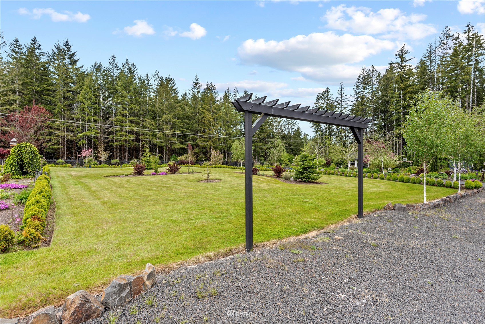 810 Logan Hill Road Chehalis, WA 98532 - Photo 26 of 39 a view of a golf course with a lake view