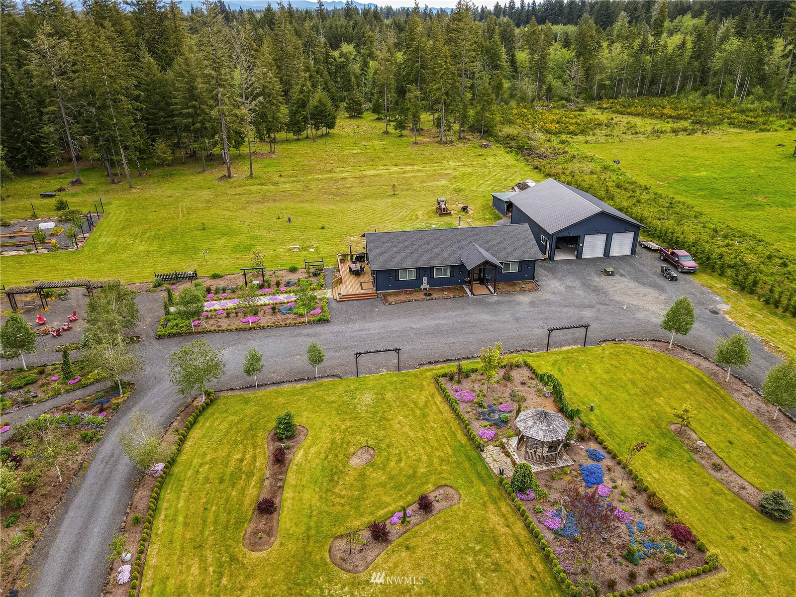 810 Logan Hill Road Chehalis, WA 98532 - Photo 33 of 39 a view of a swimming pool with an outdoor space and seating area