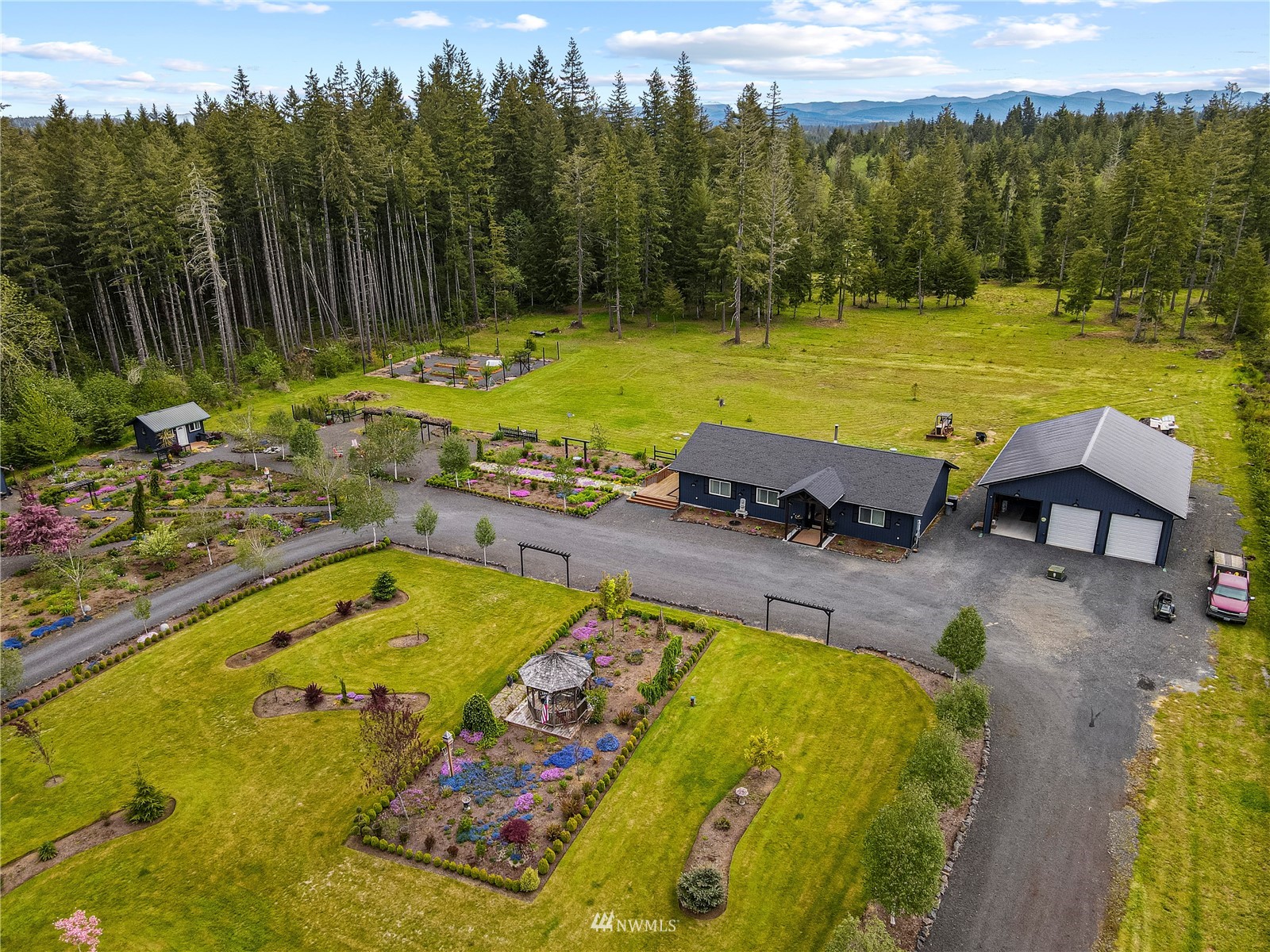 810 Logan Hill Road Chehalis, WA 98532 - Photo 34 of 39 a view of a swimming pool with a yard and lake view