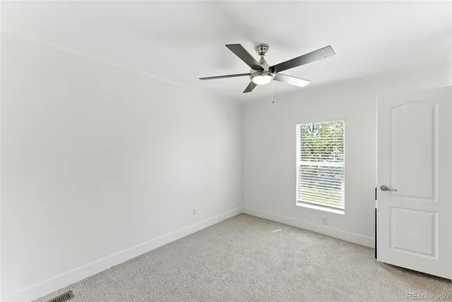 a bathroom with a sink toilet and mirror