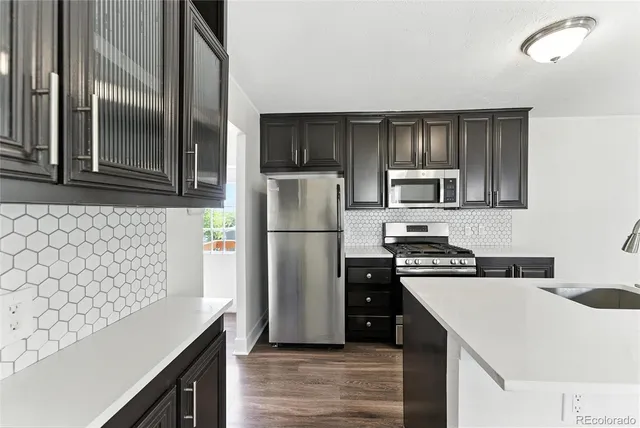 a view of kitchen with cabinets and wooden floor