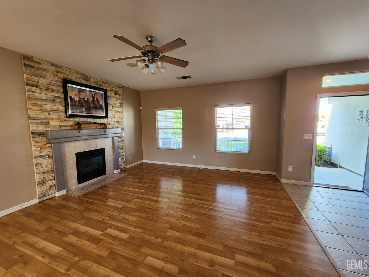 Undisclosed Address Bakersfield, CA 93313 - Photo 11 of 19 a view of an empty room with window and fire place