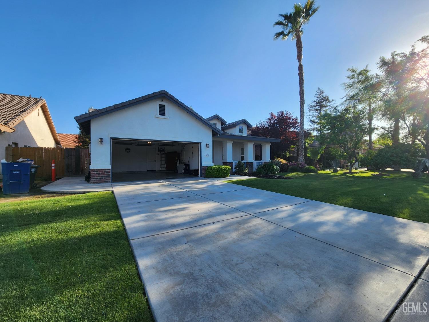 Undisclosed Address Bakersfield, CA 93313 - Photo 17 of 19 a front view of a house with a yard