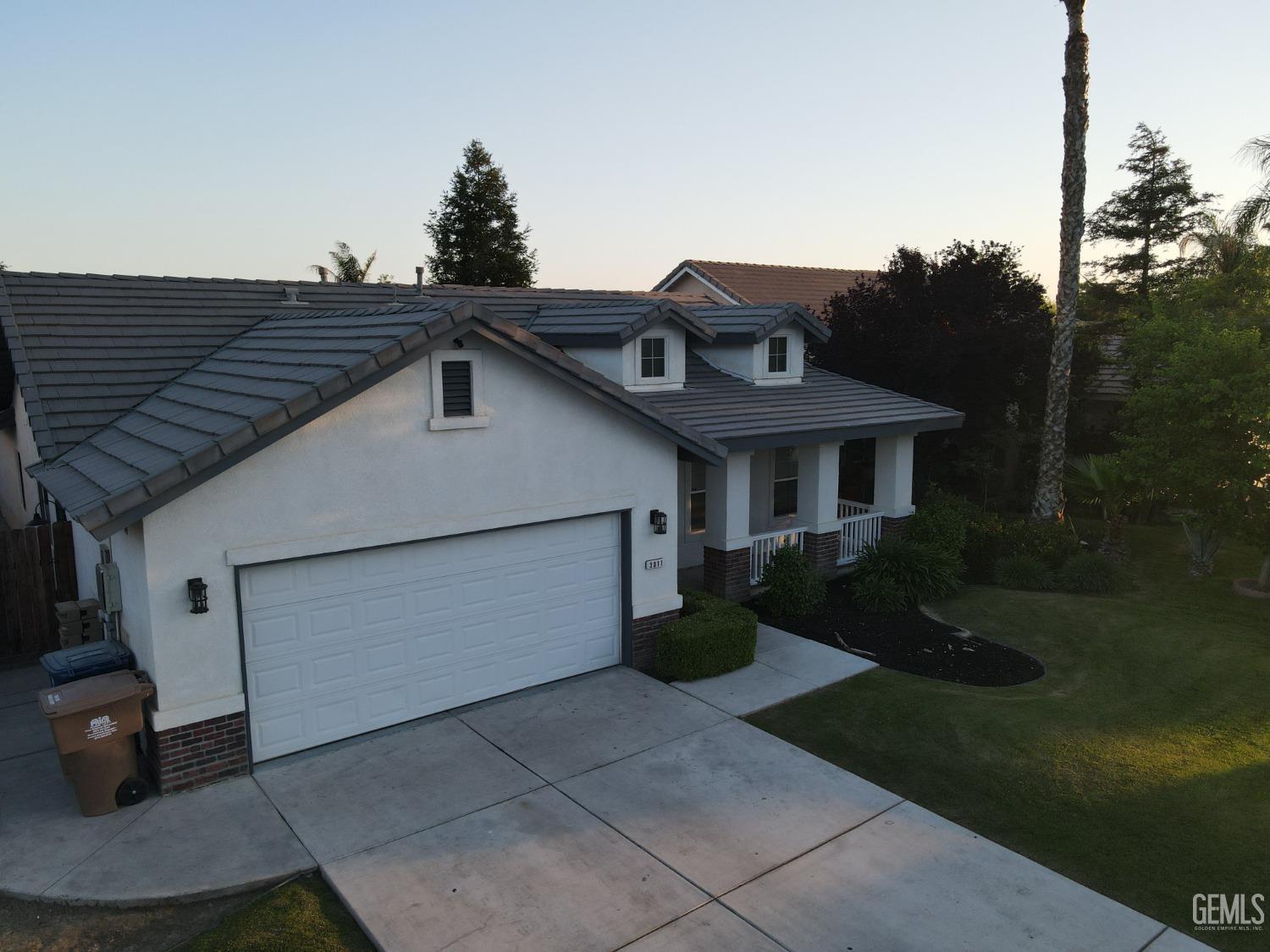 Undisclosed Address Bakersfield, CA 93313 - Photo 18 of 19 a front view of a house with a yard