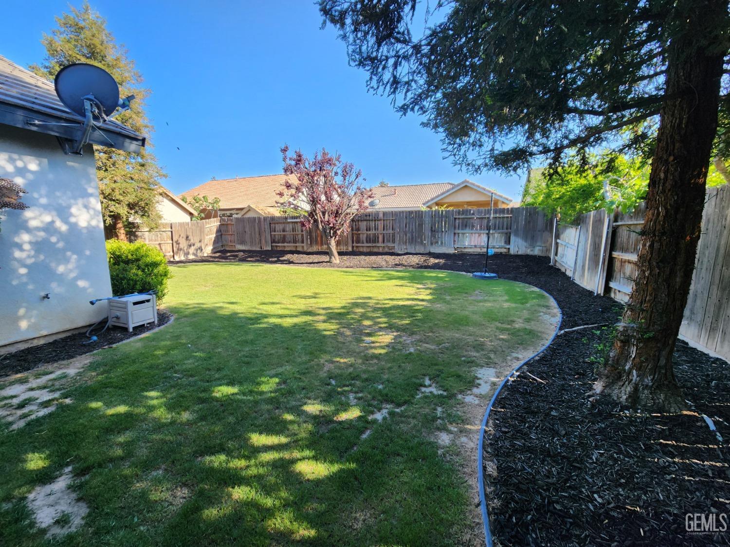 Undisclosed Address Bakersfield, CA 93313 - Photo 6 of 19 a view of a house with a yard